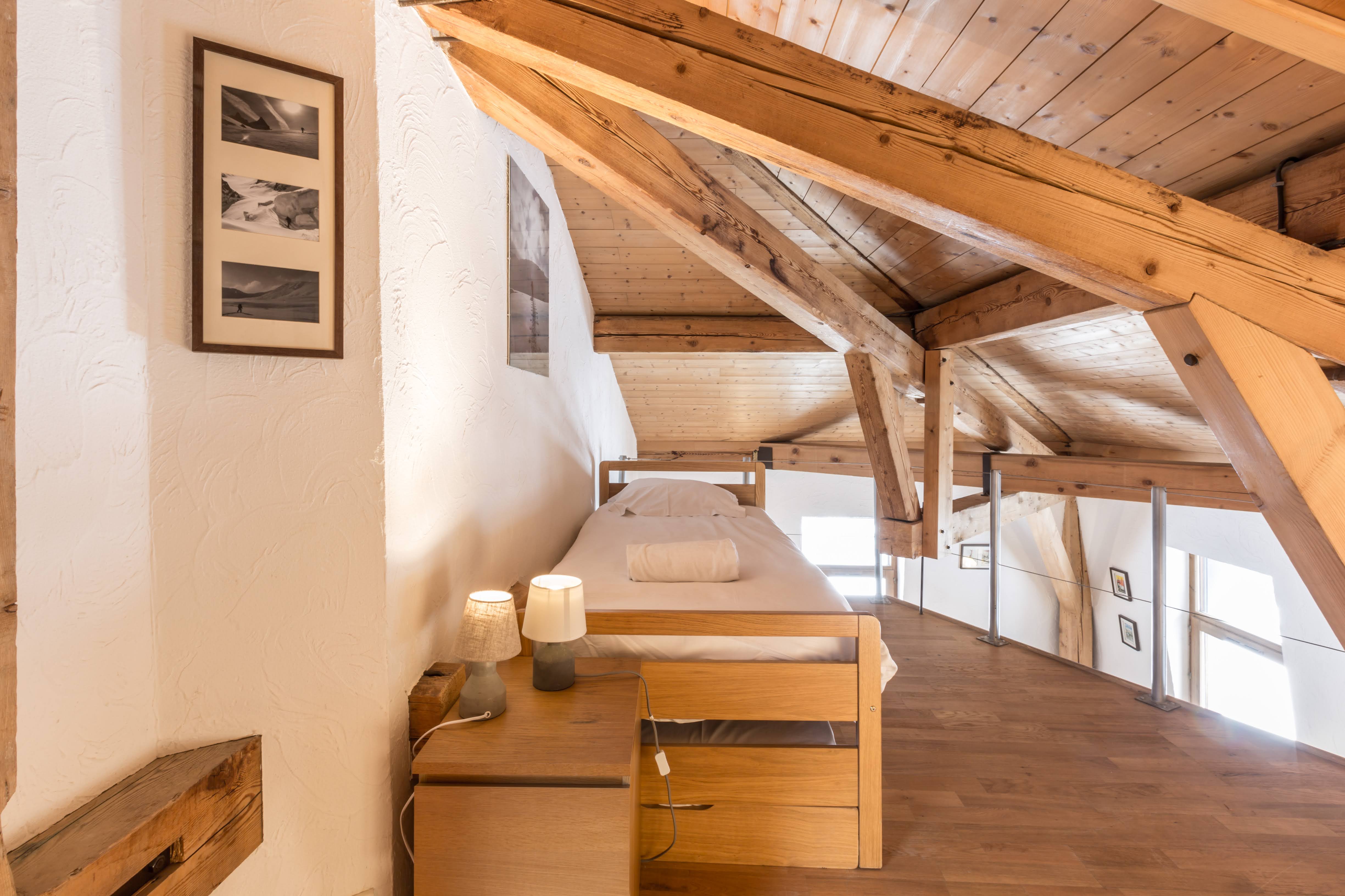 Mezzanine bedroom with timber beams